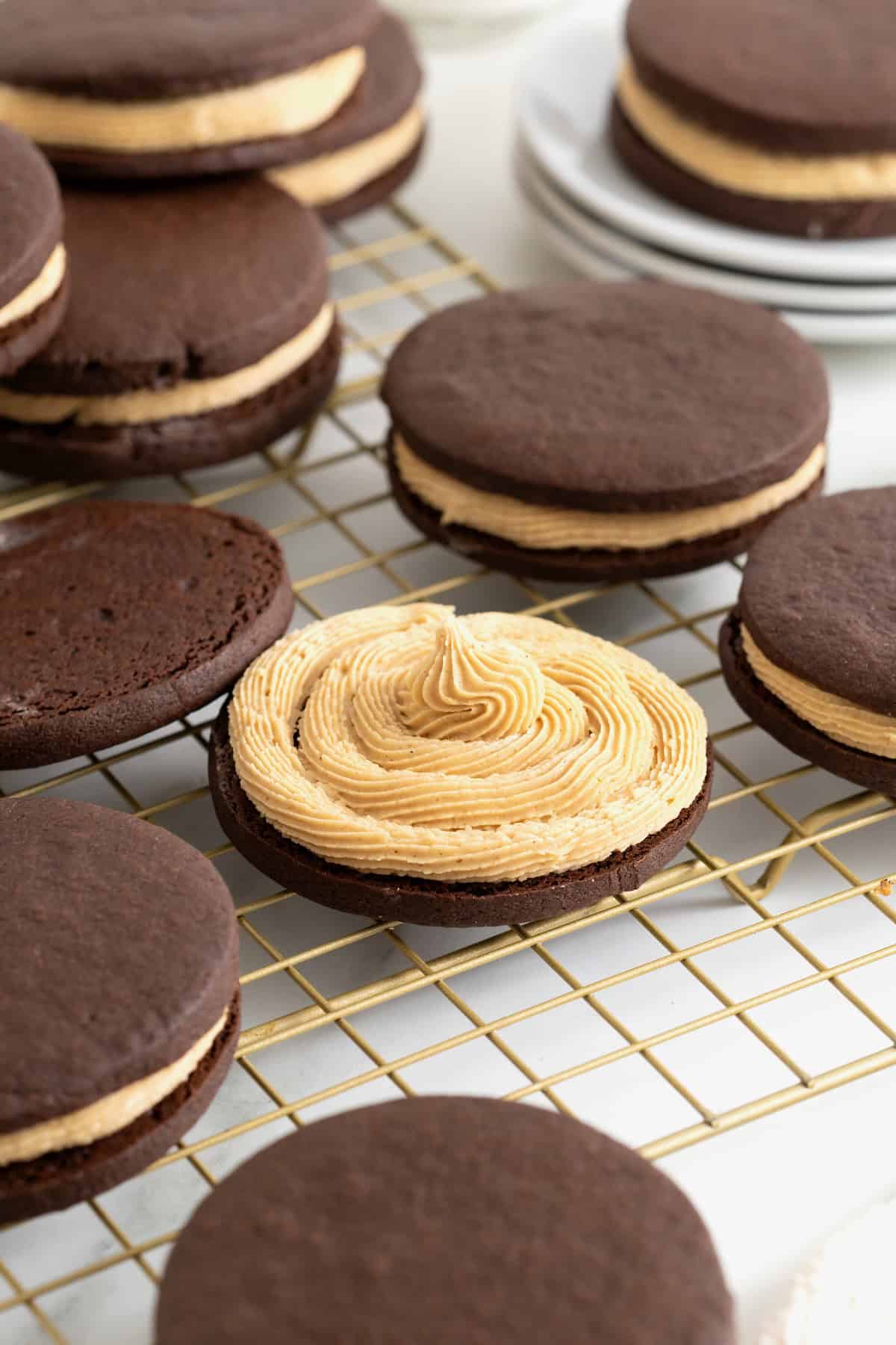 A chocolate cookie piped with peanut butter cream.