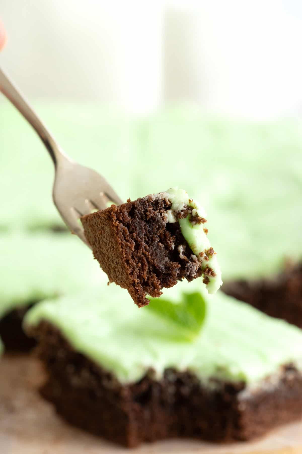 A bite of mint julep brownie on a metal fork.