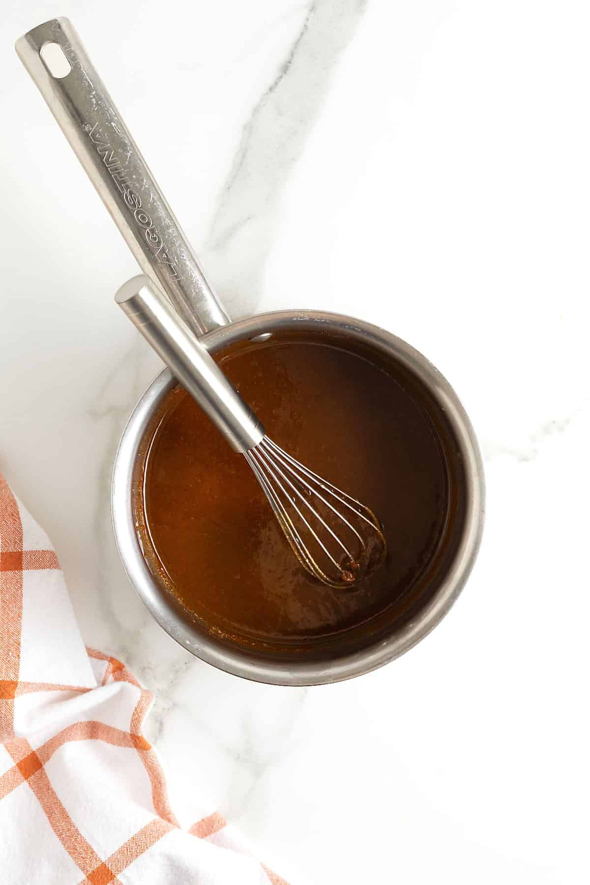 A saucepan of pumpkin spice syrup.