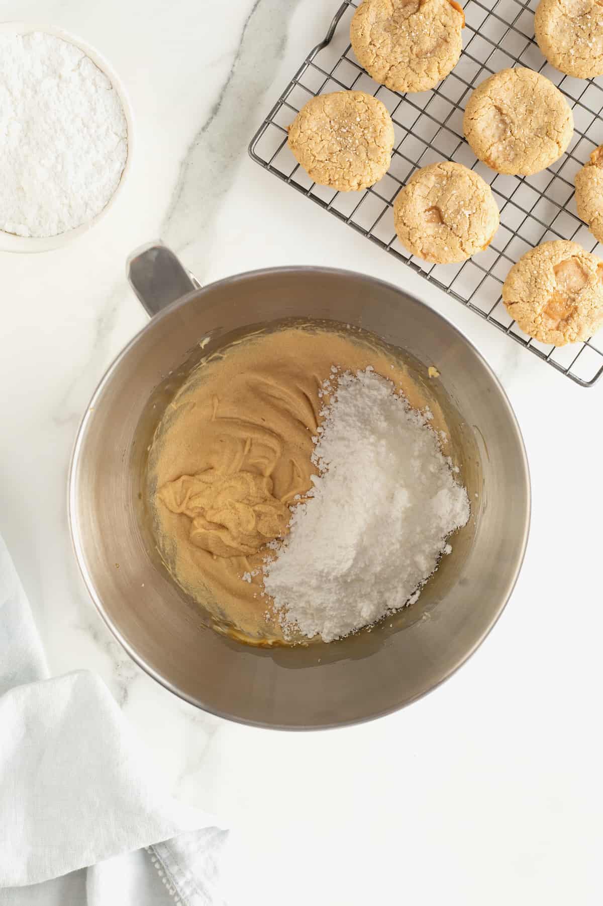 Powdered sugar in a mixing bowl with cream filling.