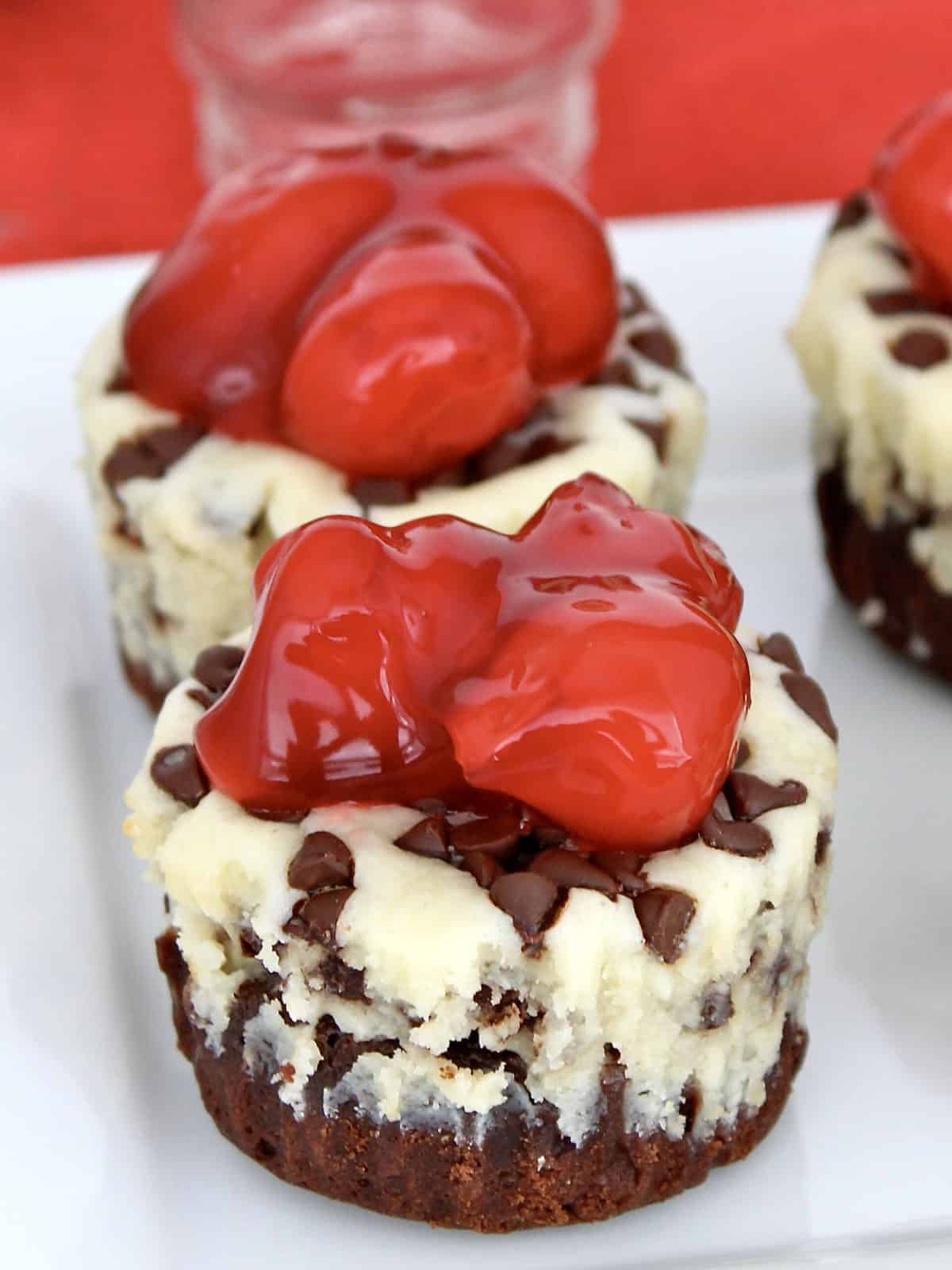 Mini Cherry Chocolate Chip Cheesecakes by The BakerMama