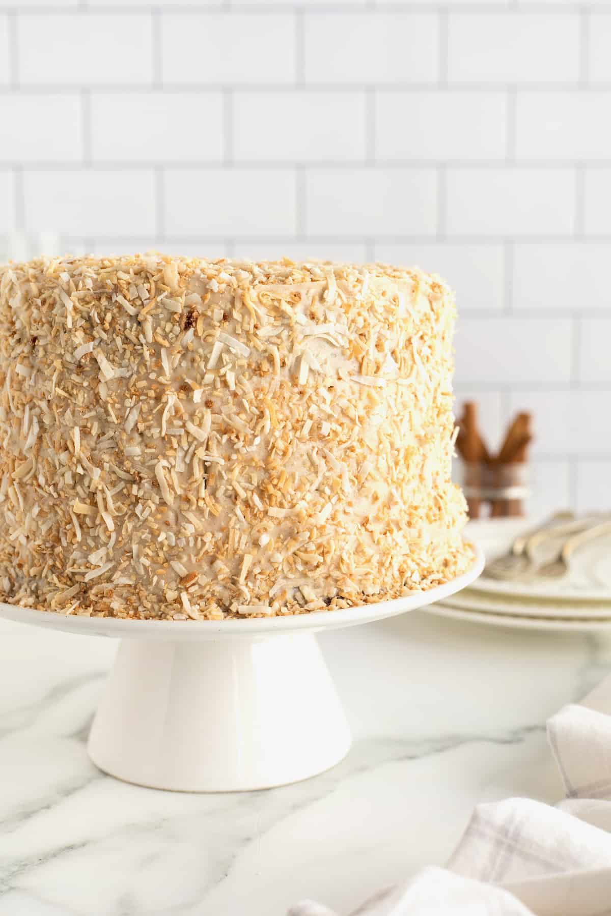 Coconut Carrot Cake with Cinnamon Cream Cheese Frosting by The BakerMama