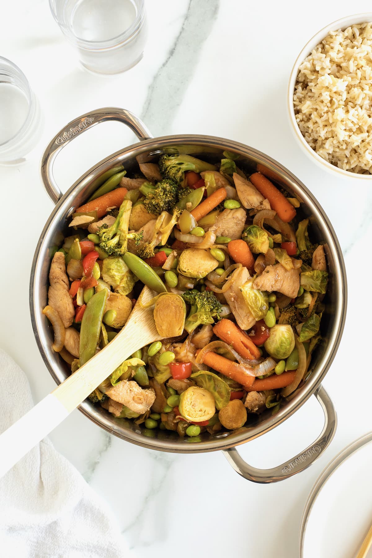 Stir fried chicken and vegetables in a pot.