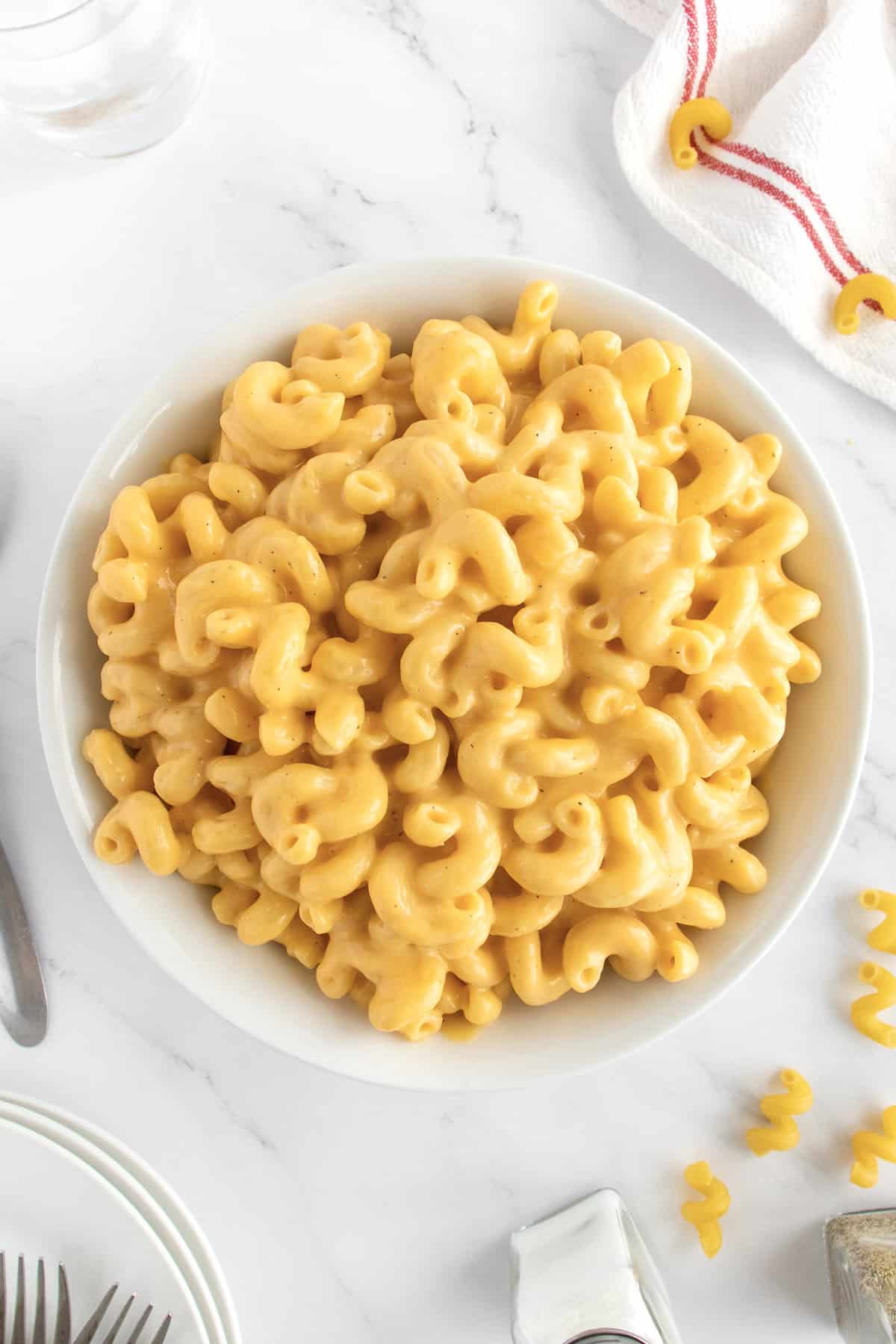 A large white bowl filled with macaroni and cheese.