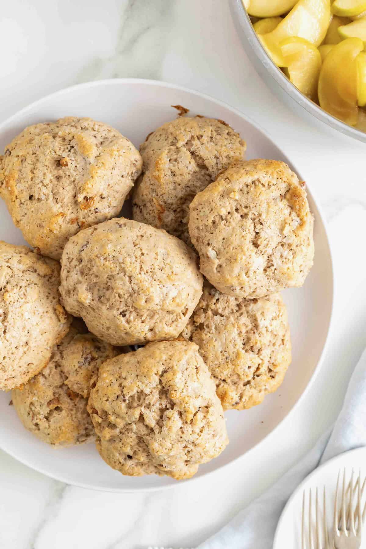 Pecan biscuits on a white rimmed platter.