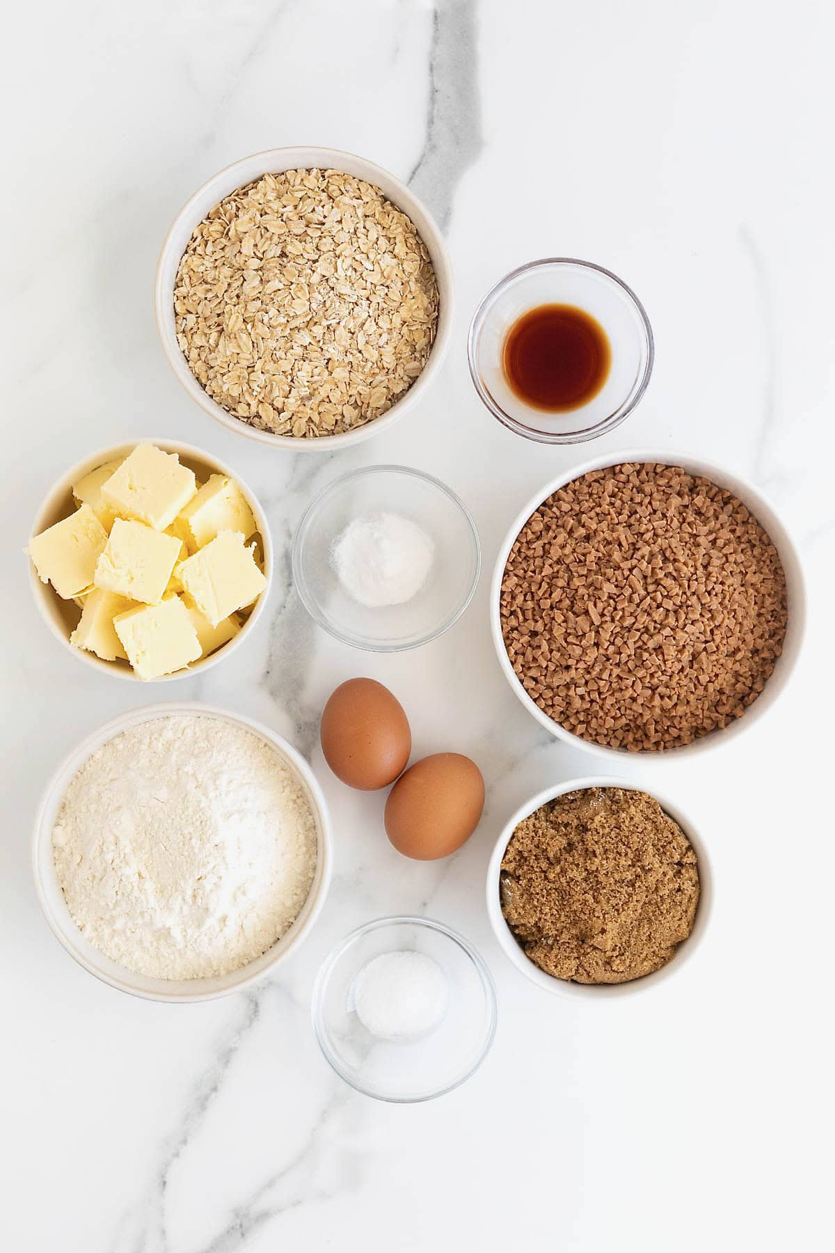 Ingredients to make brown sugar oatmeal cookies with toffee bits.