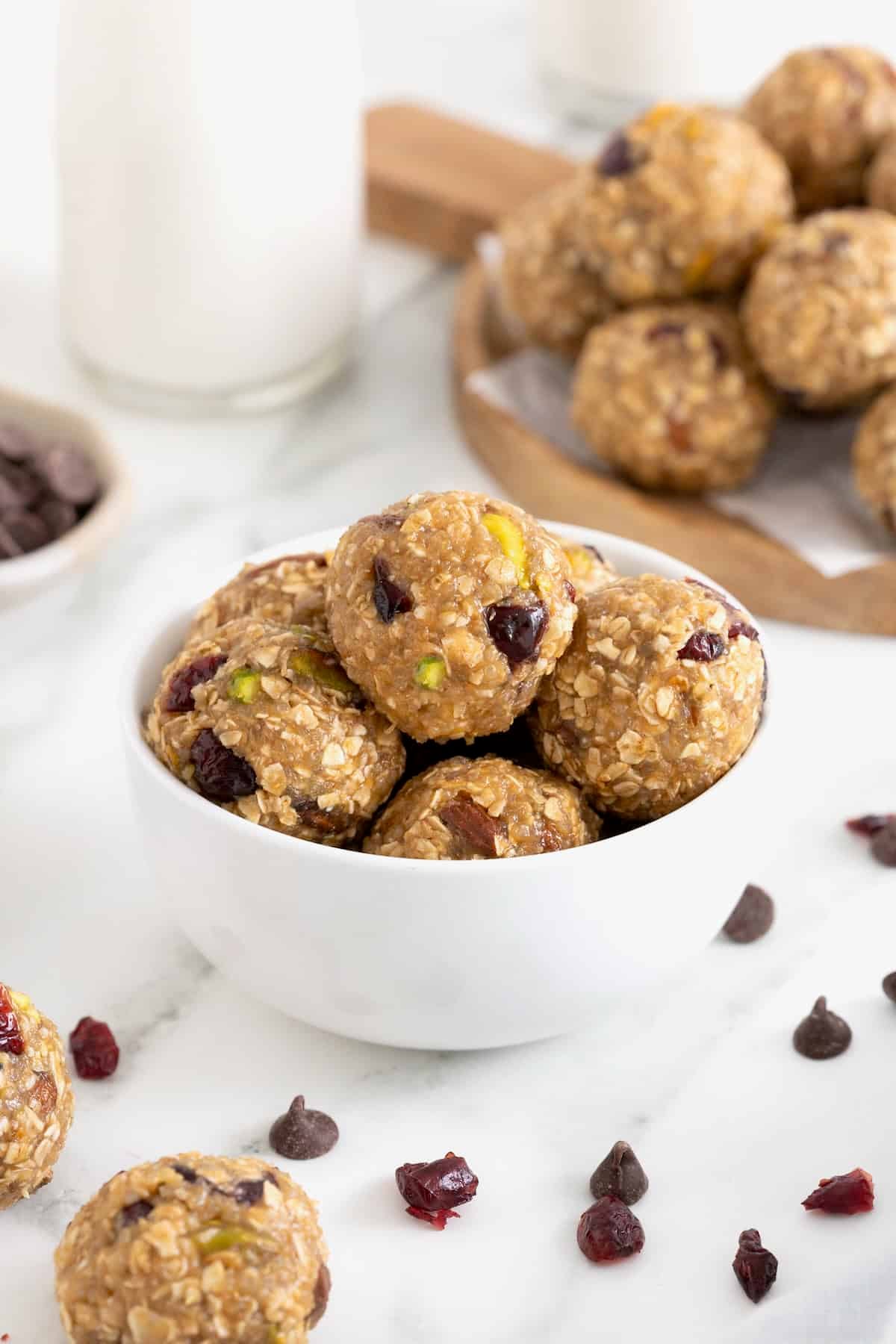 A white bowl of trail mix quinoa bites.