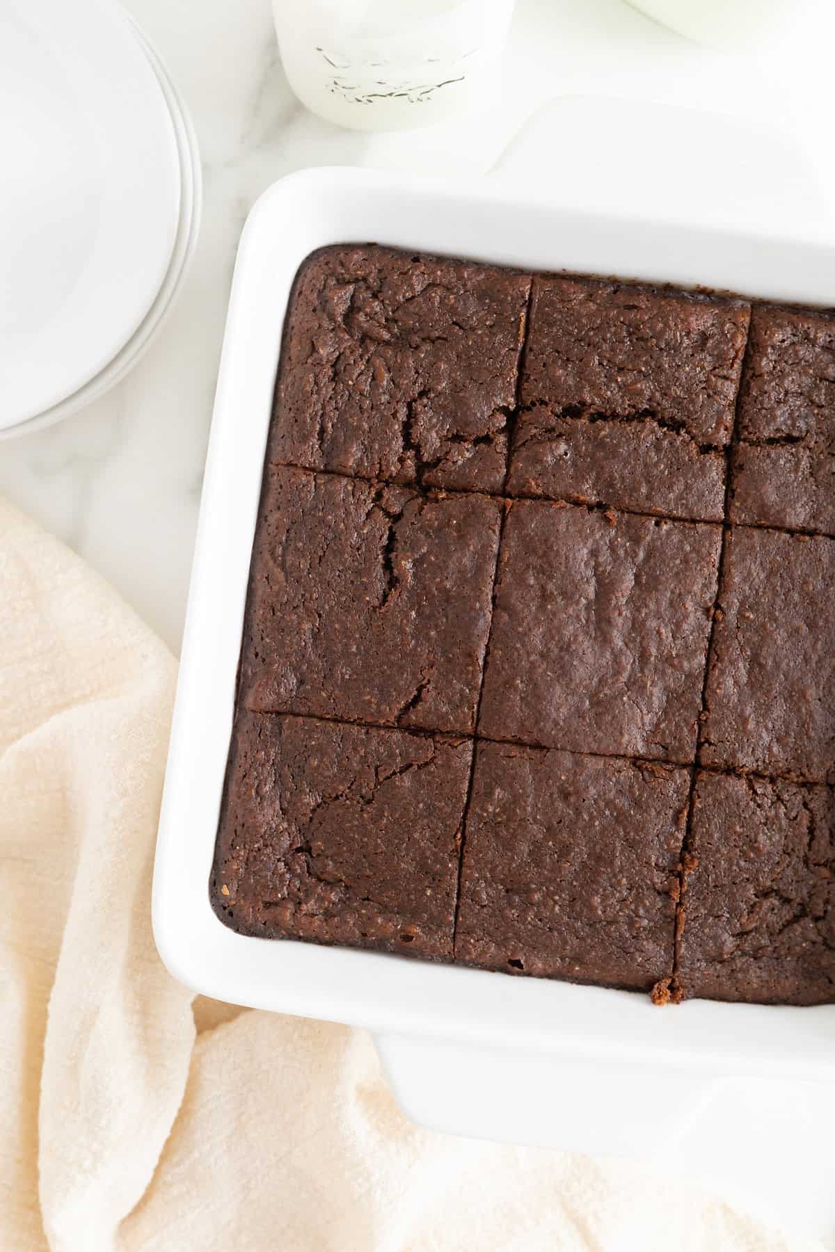 A white 8x8 baking dish of whole wheat sweet potato brownies.