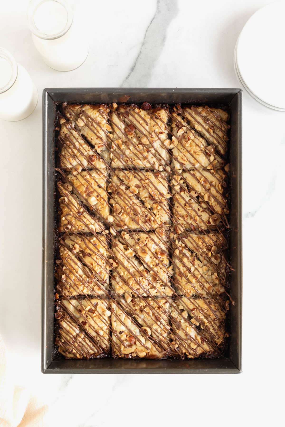 A dark aluminum baking pan of Nutella baklava.