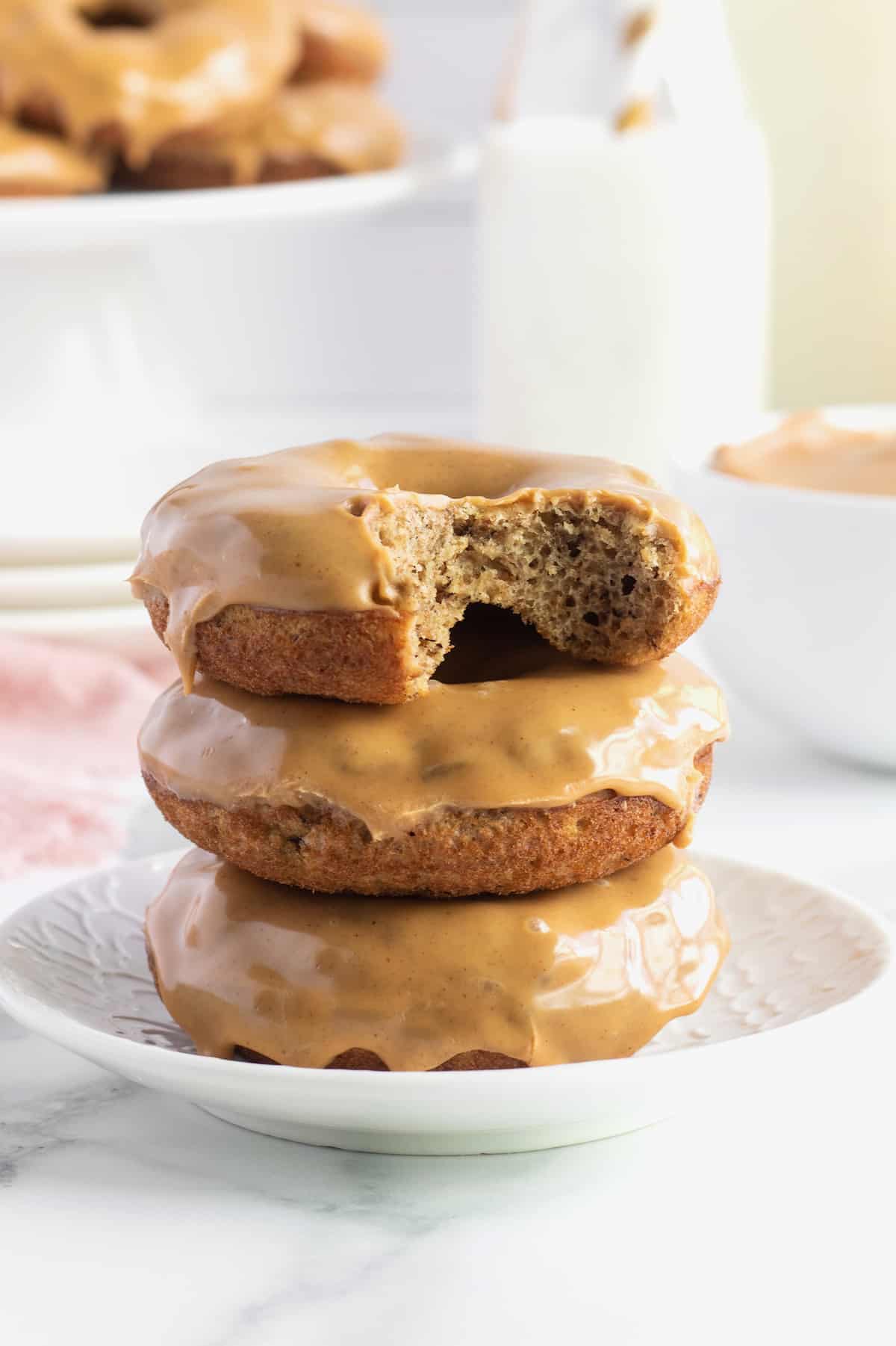 Whole Wheat Baked Banana Donuts with a Peanut Butter Glaze by The BakerMama