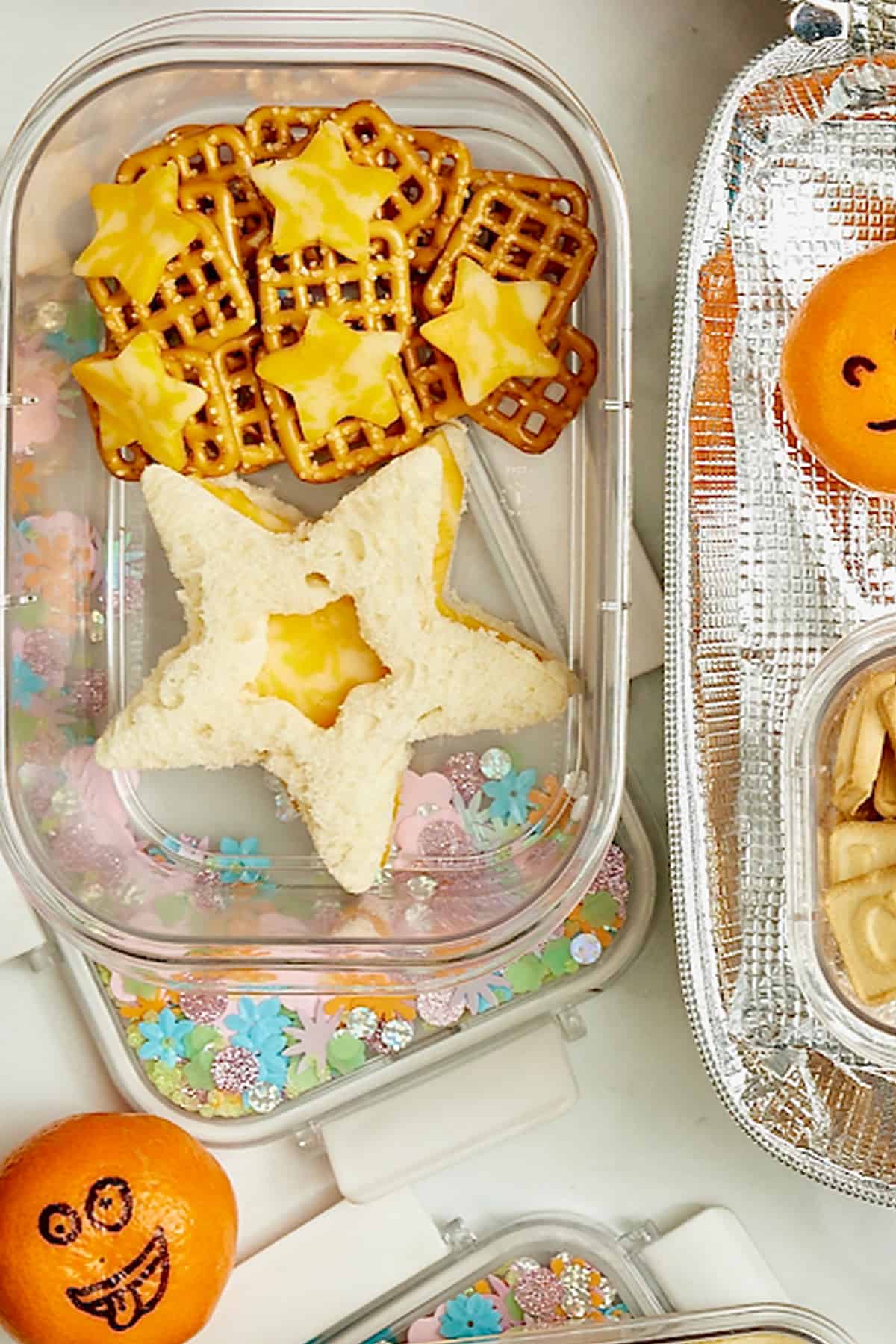 A star shaped cheese sandwich, star shaped cheese slices on pretzels.