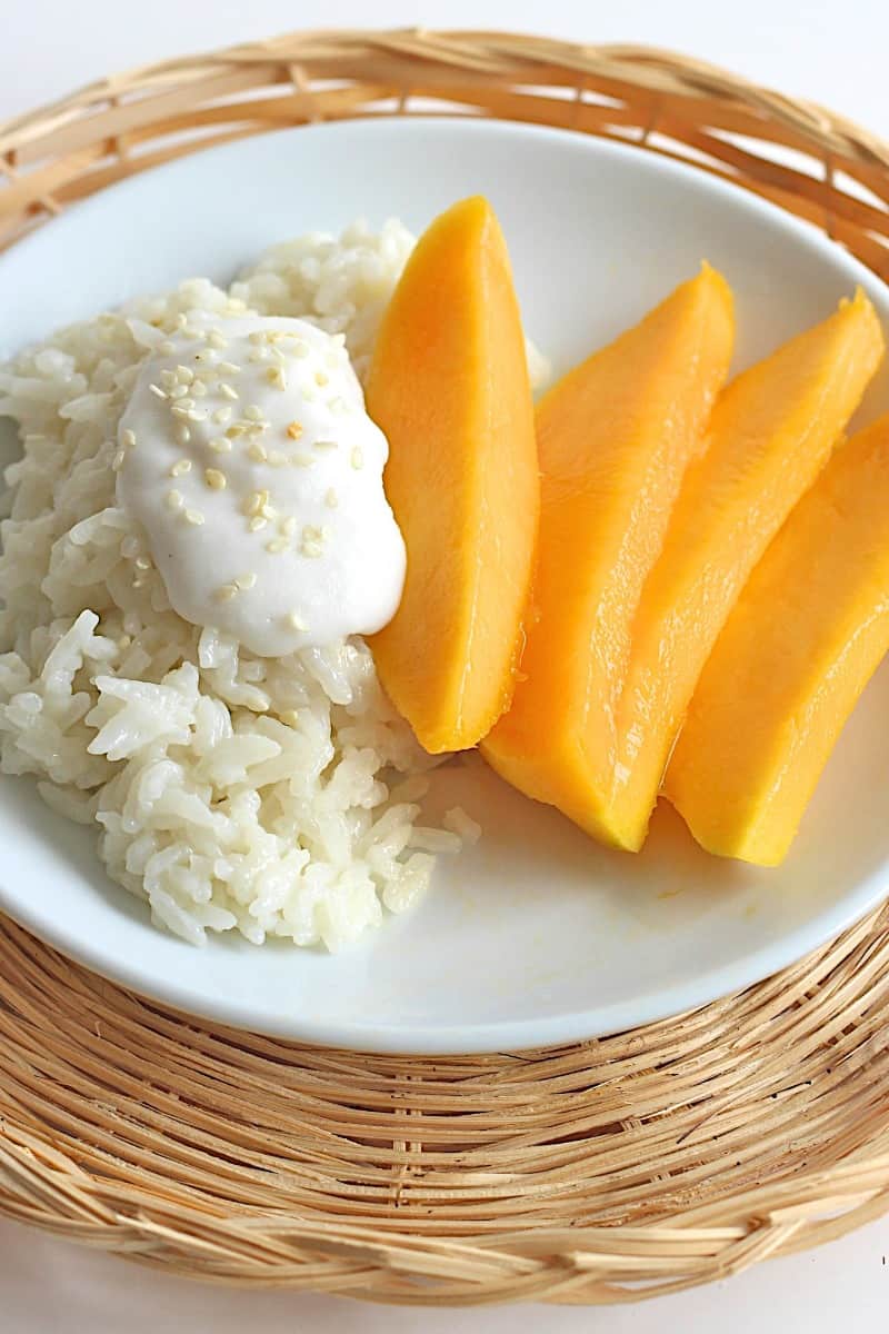 Mango Sticky Rice - a traditional Thai dessert of sticky rice that’s been soaked in a lightly sweetened coconut cream with fresh mango on the side.