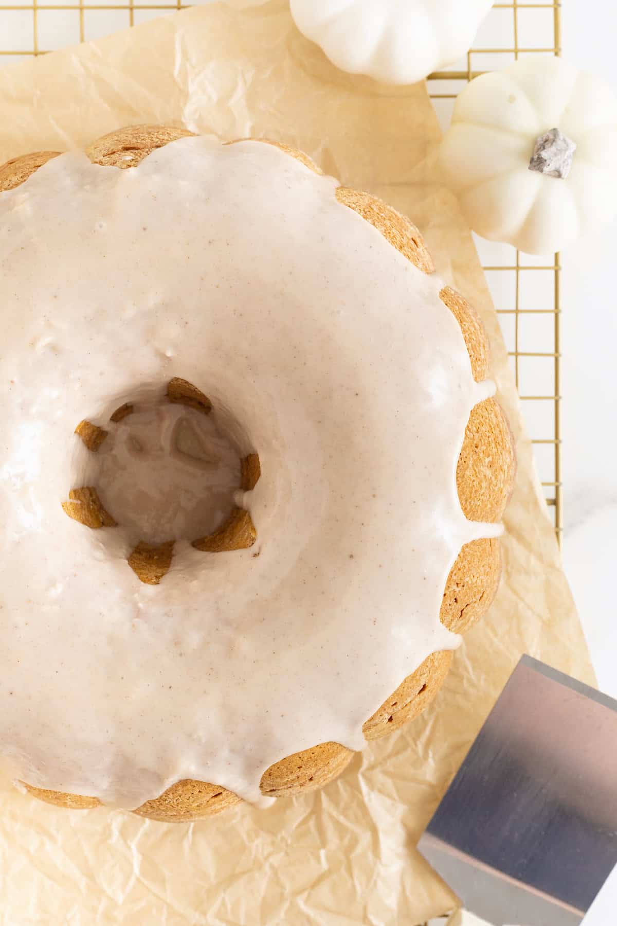 A white glaze on a chai spiced pumpkin pound cake.