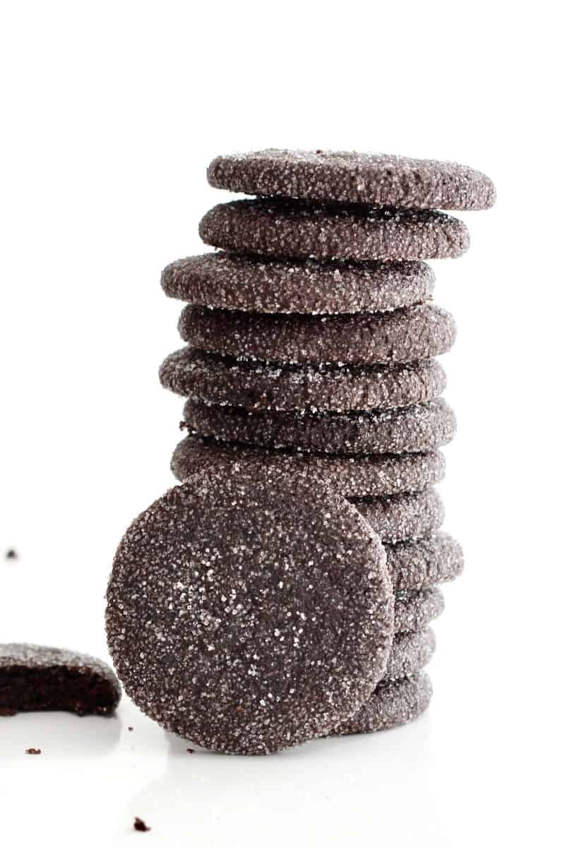 A stack of Chocolate Sugar Cookies that are coated in sugar.