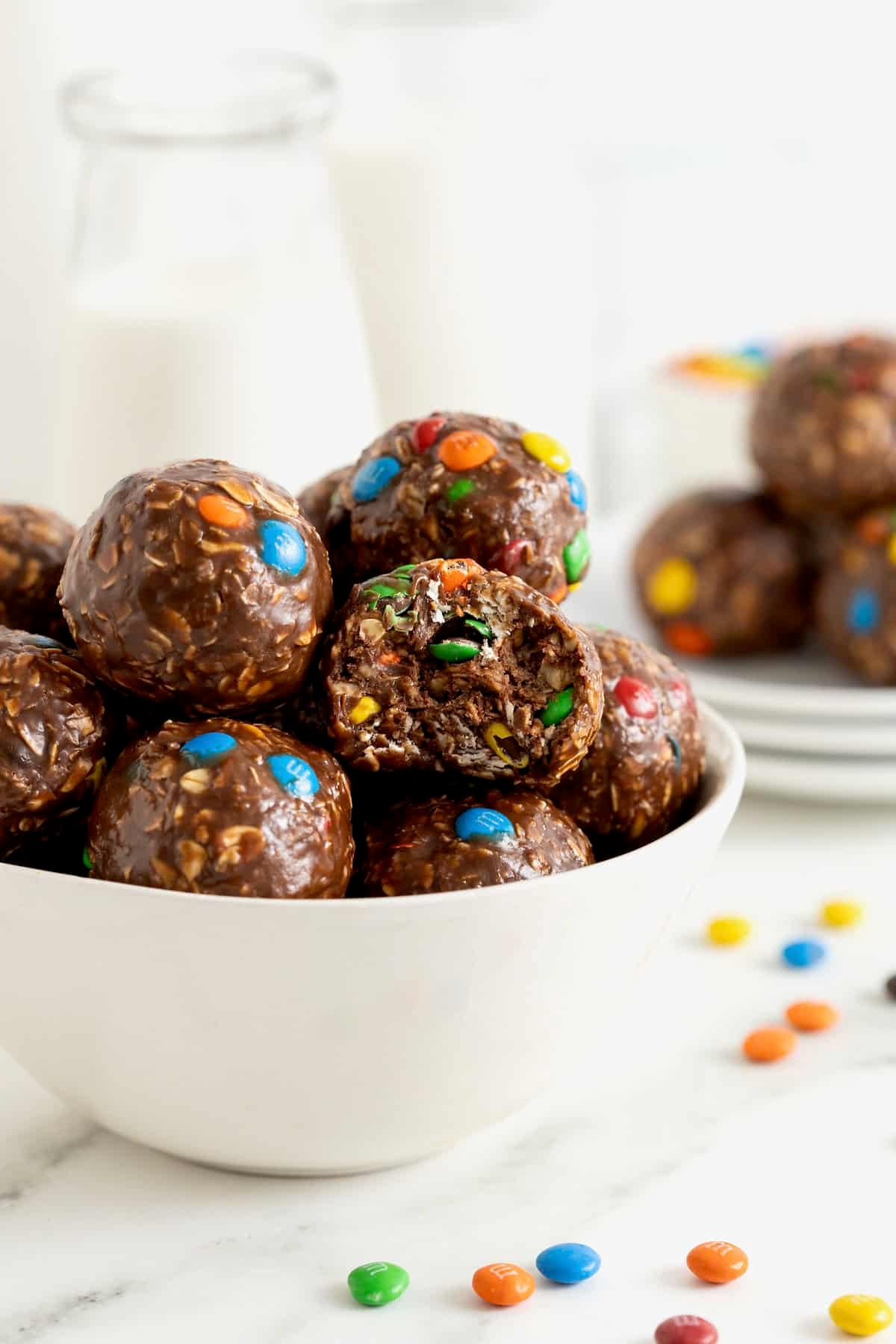 A white bowl of Nutella M&M oatmeal balls.