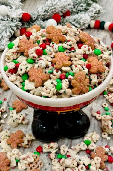 Christmas Crunch Snack mix in a festive Santa Claus bowl.