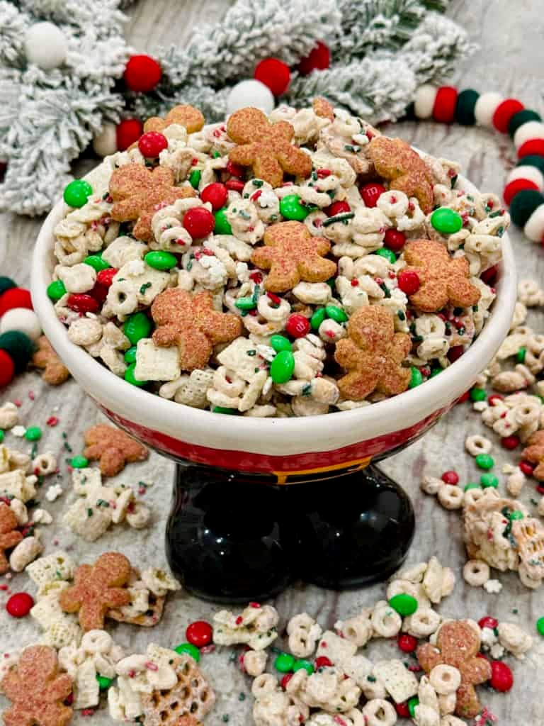 Christmas Crunch Snack mix in a festive Santa Claus bowl.