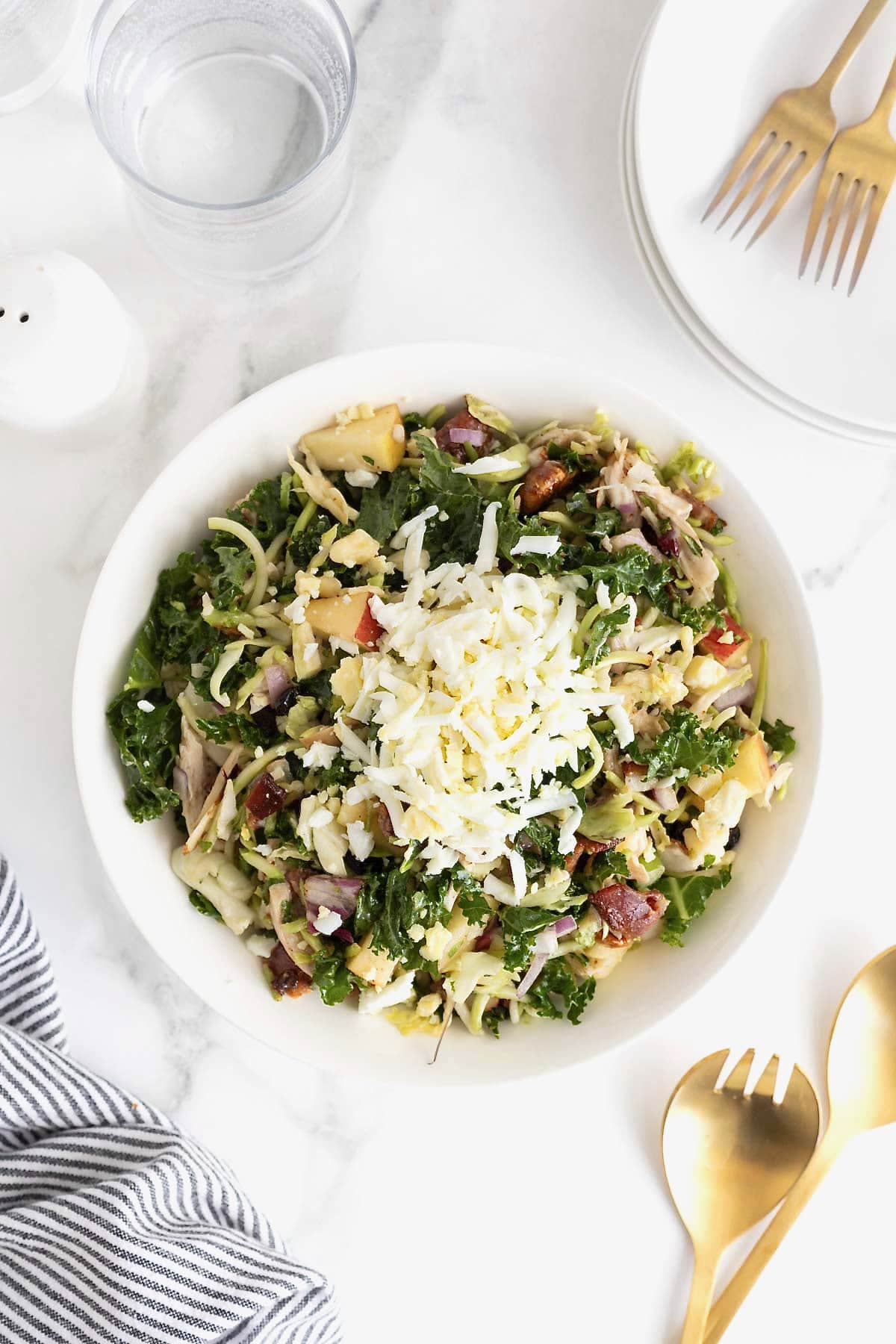 Shredded egg on a kale and chicken salad.