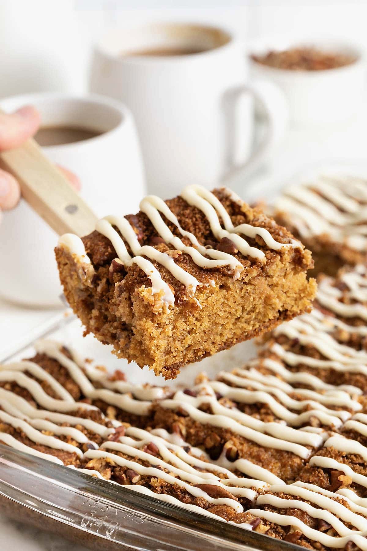 Cream cheese coffee cake on a spatula.