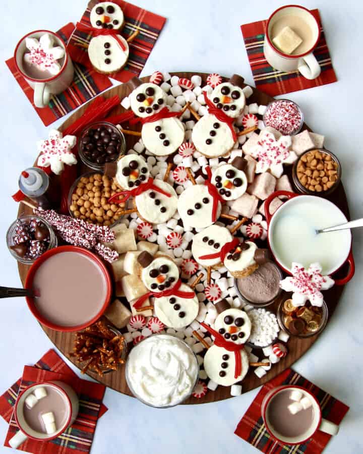 Hot Chocolate Board featuring Snowman Scotcheroos by The BakerMama