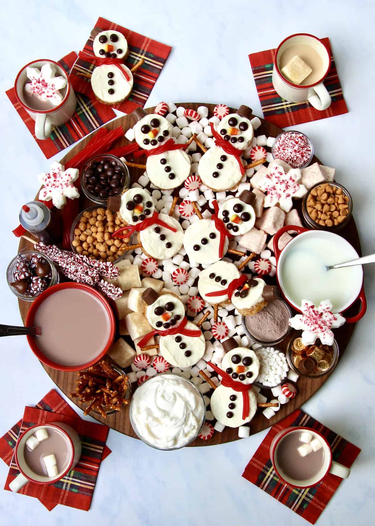 Hot Chocolate Board Featuring Snowmen Scotcheroos by The BakerMama