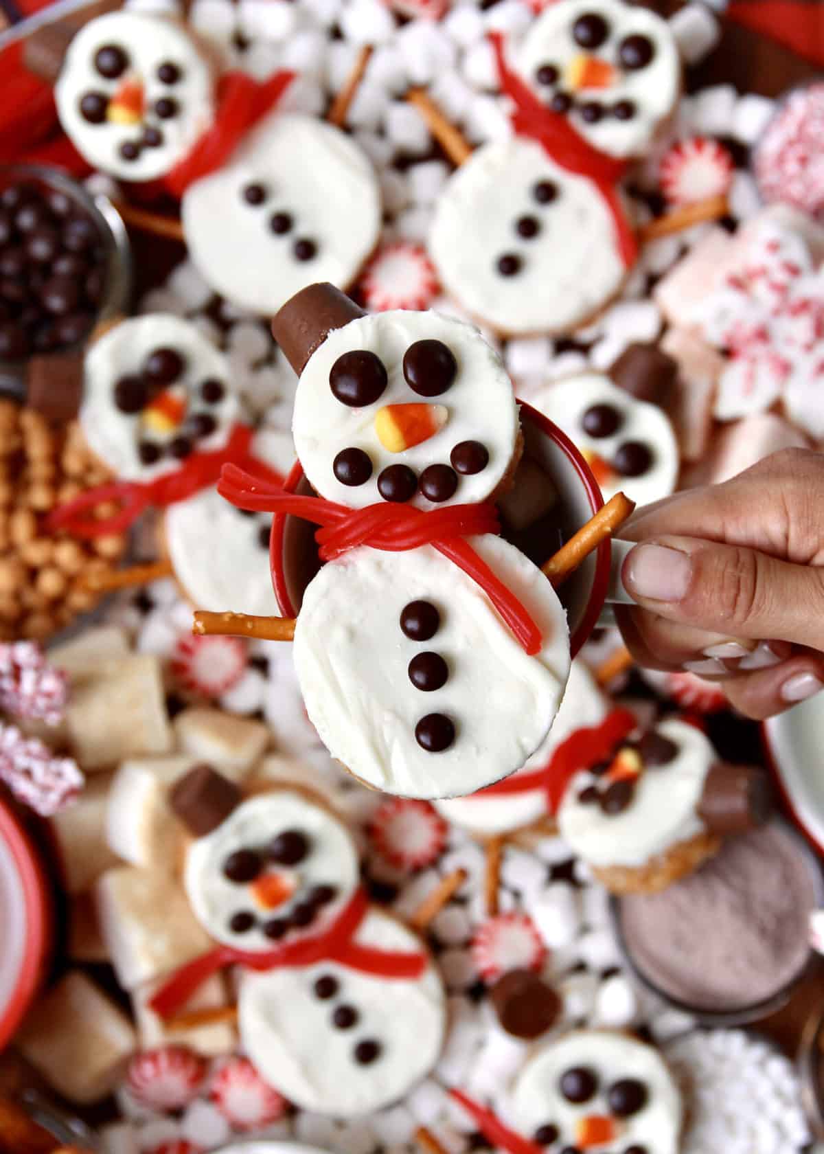 Hot Chocolate Board featuring Snowman Scotcheroos by The BakerMama
