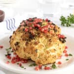 Whole Roasted Garlic and Herb Cauliflower with Pomegranate Seeds