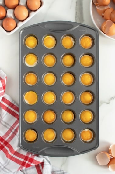 Runny Eggs in a Muffin Pan by The BakerMama