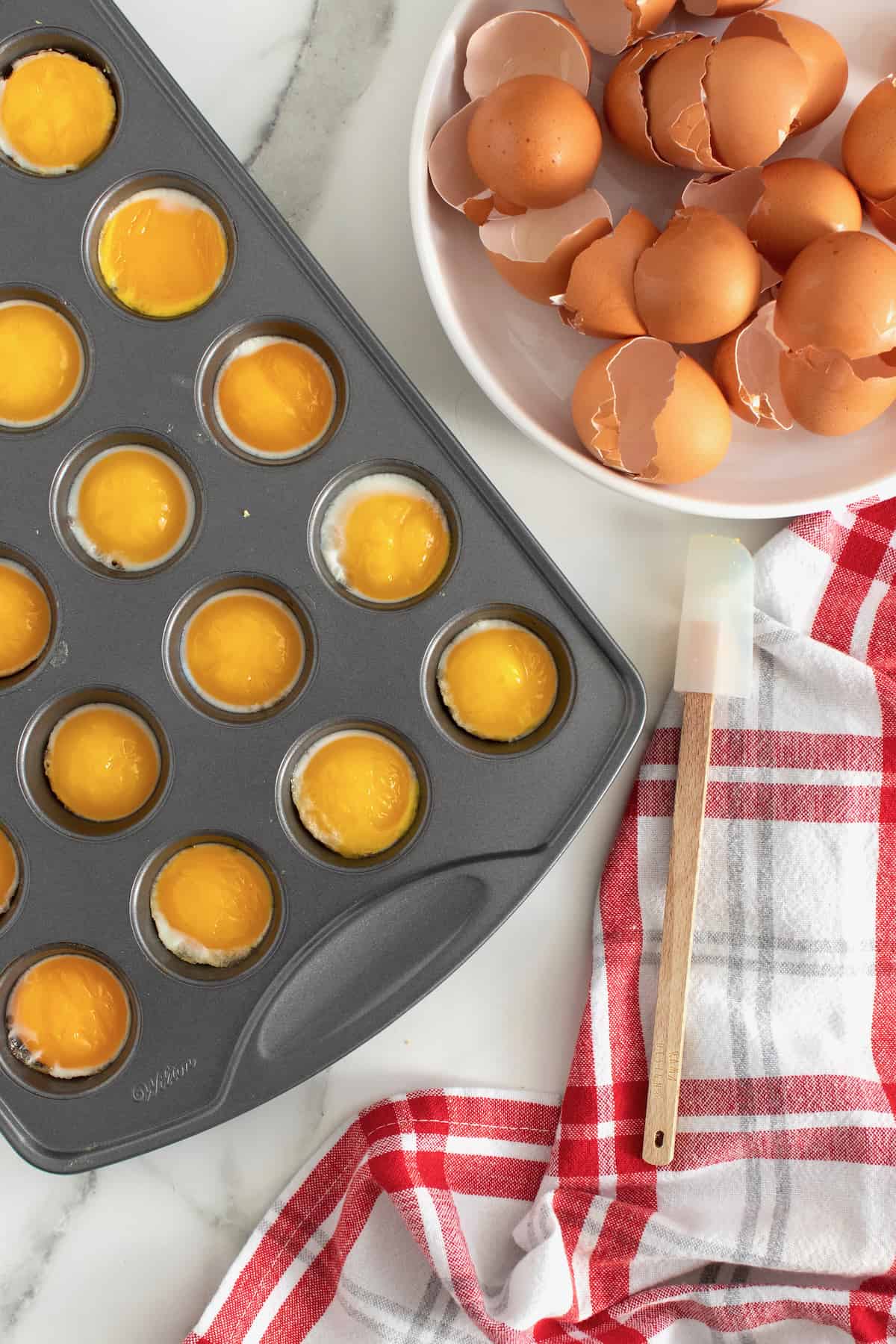 Runny Eggs in a Muffin Tin by The BakerMama