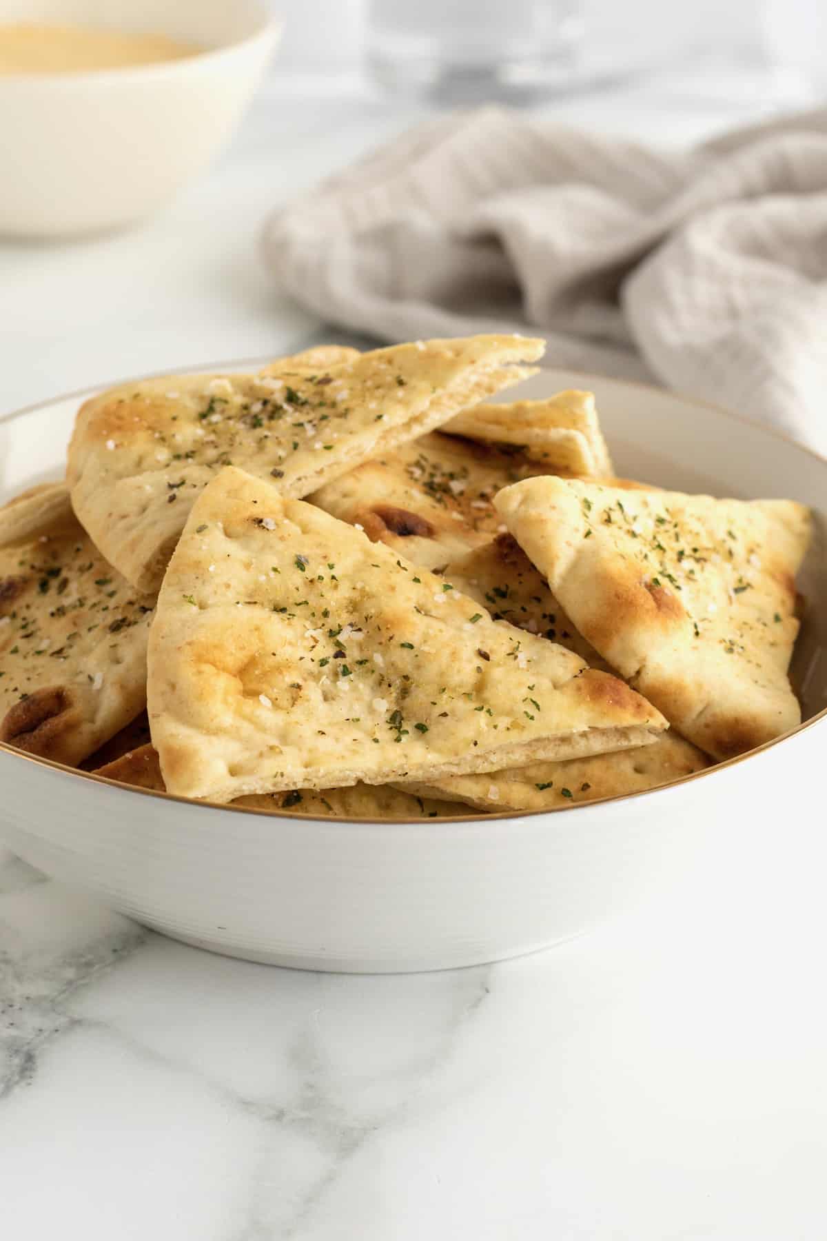 https://thebakermama.com/wp-content/uploads/2023/05/Baked-Pita-Chips.jpeg