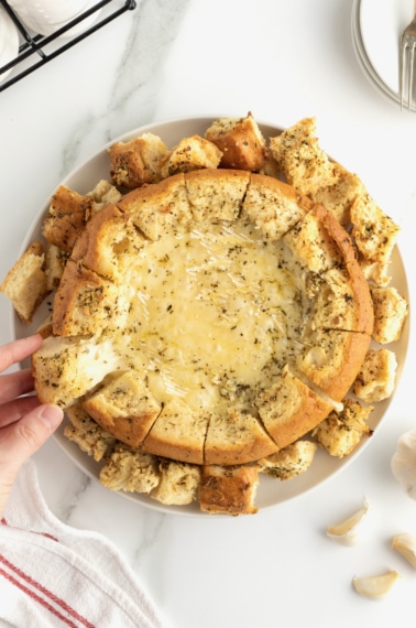 Garlic Butter Baked Brie in a Bread Bowl by The BakerMama