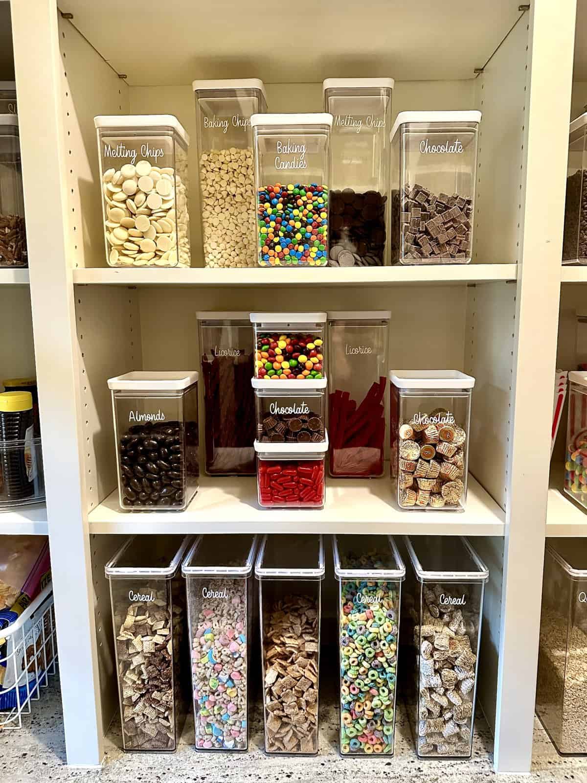 Clear containers from The Container Store filled with cereals, snacks, and treats.