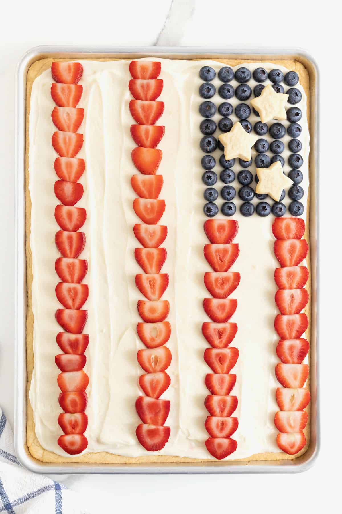 A large fruit pizza decorated to look like the American Flag.