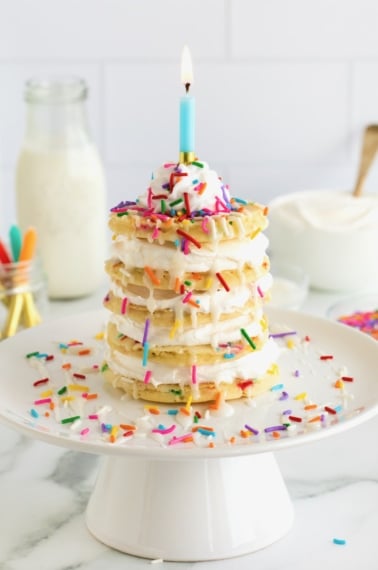 Five homemade pancakes with whipped topping between to make a layer cake.