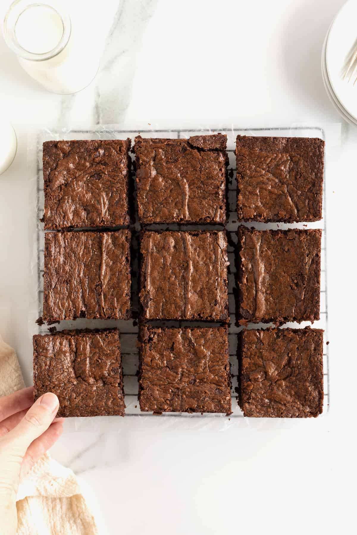 Nutella brownies with a crackly top cut into nine squares.