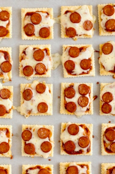 Pizza bites made with saltine crackers, melted mozzarella and mini pepperoni.