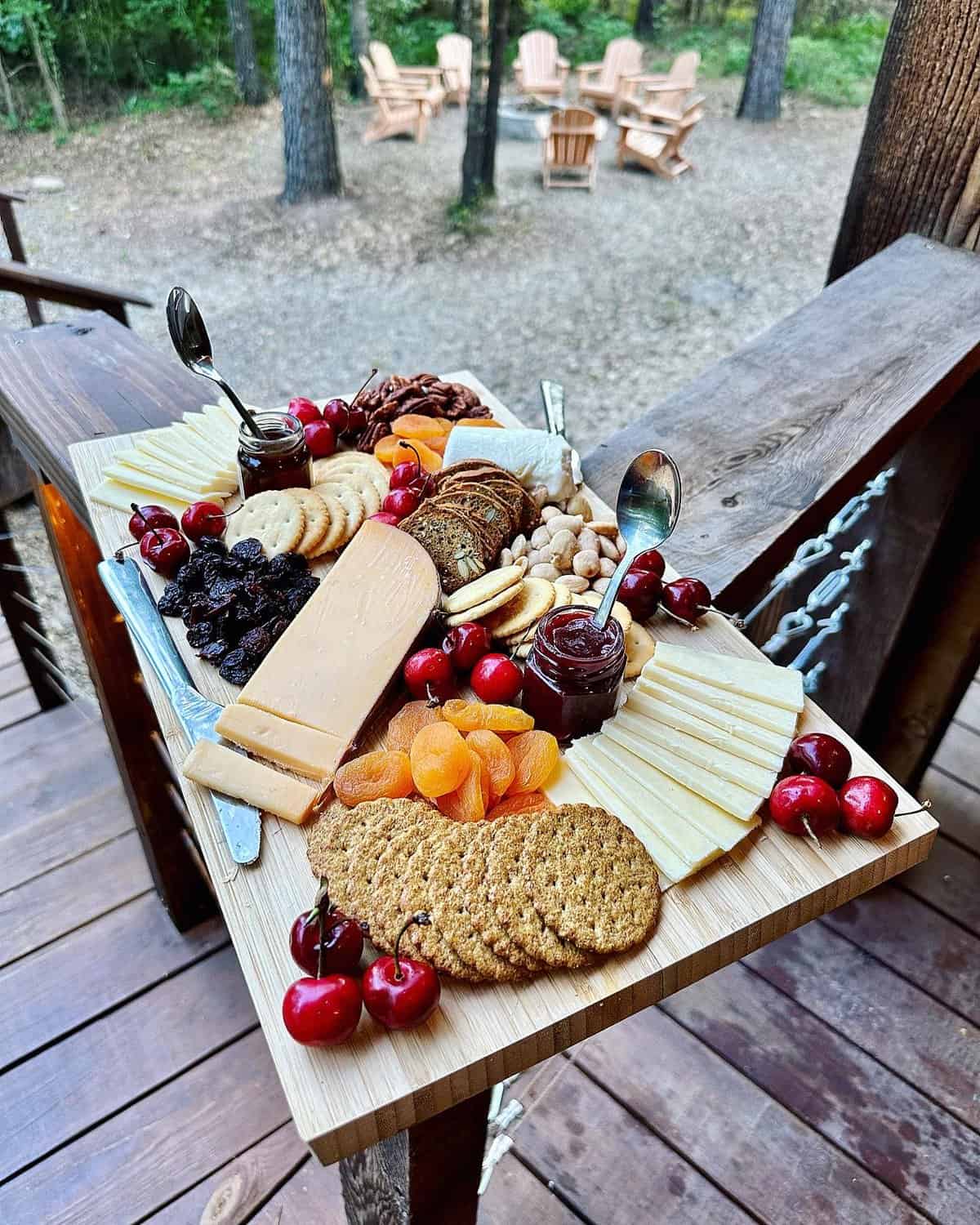 A cheese board with fruit and nuts.