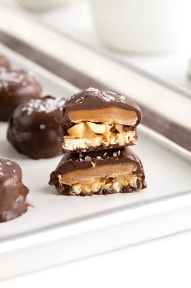 Two Take 5 Bites stacked on a parchment lined baking tray.