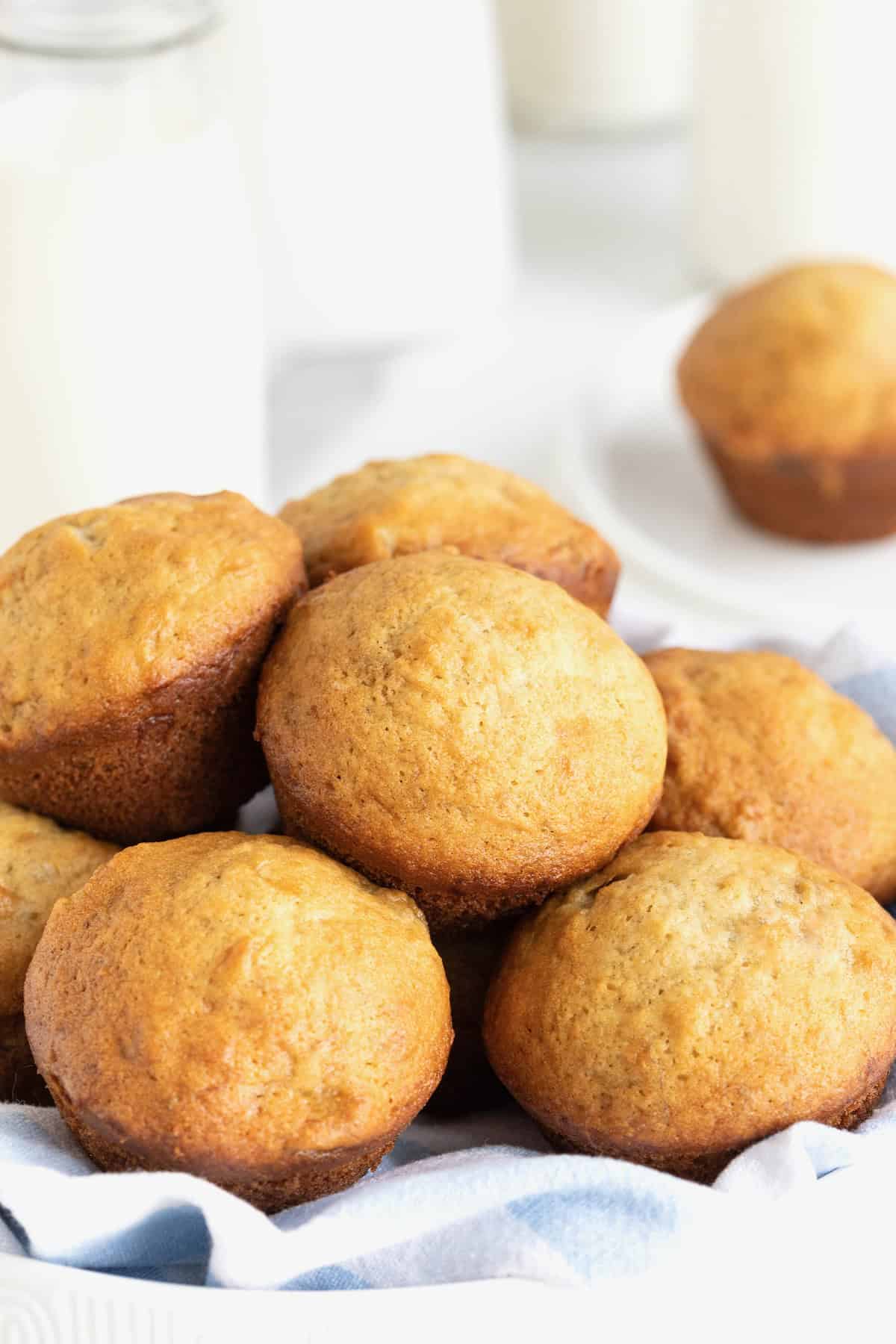 A large white bowl of banana muffins.