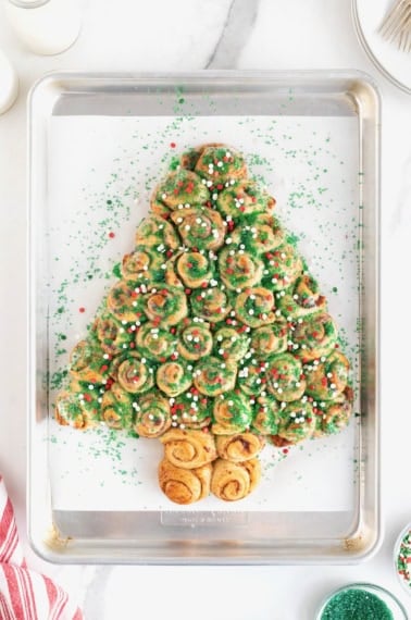 A pull-apart cinnamon roll shaped like a Christmas tree.