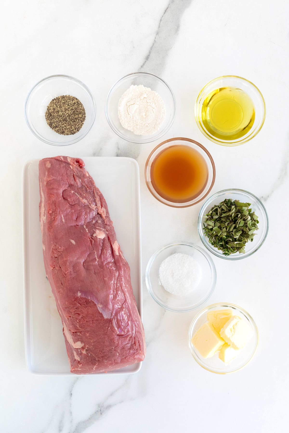 Ingredients to make a roasted beef tenderloin.