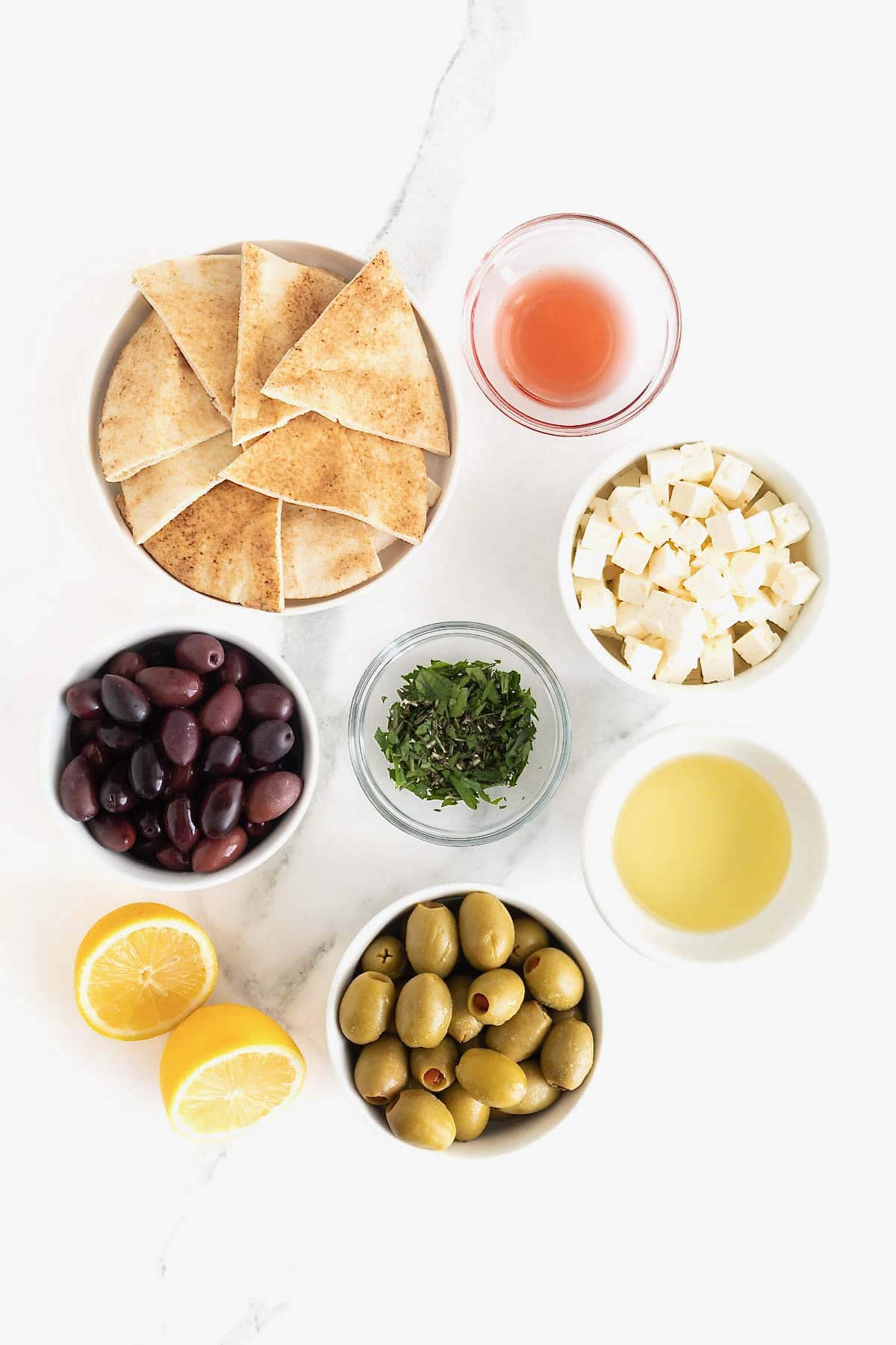 Ingredients to make marinated olives and feta.