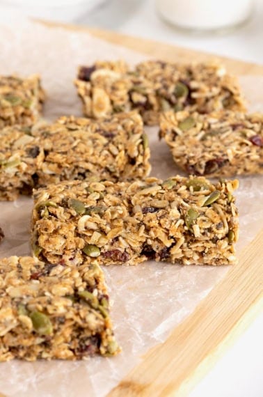 Six power bars on a parchment lined wooden board.