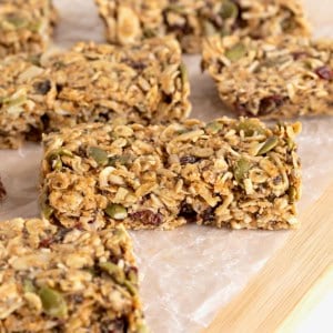 Six power bars on a parchment lined wooden board.