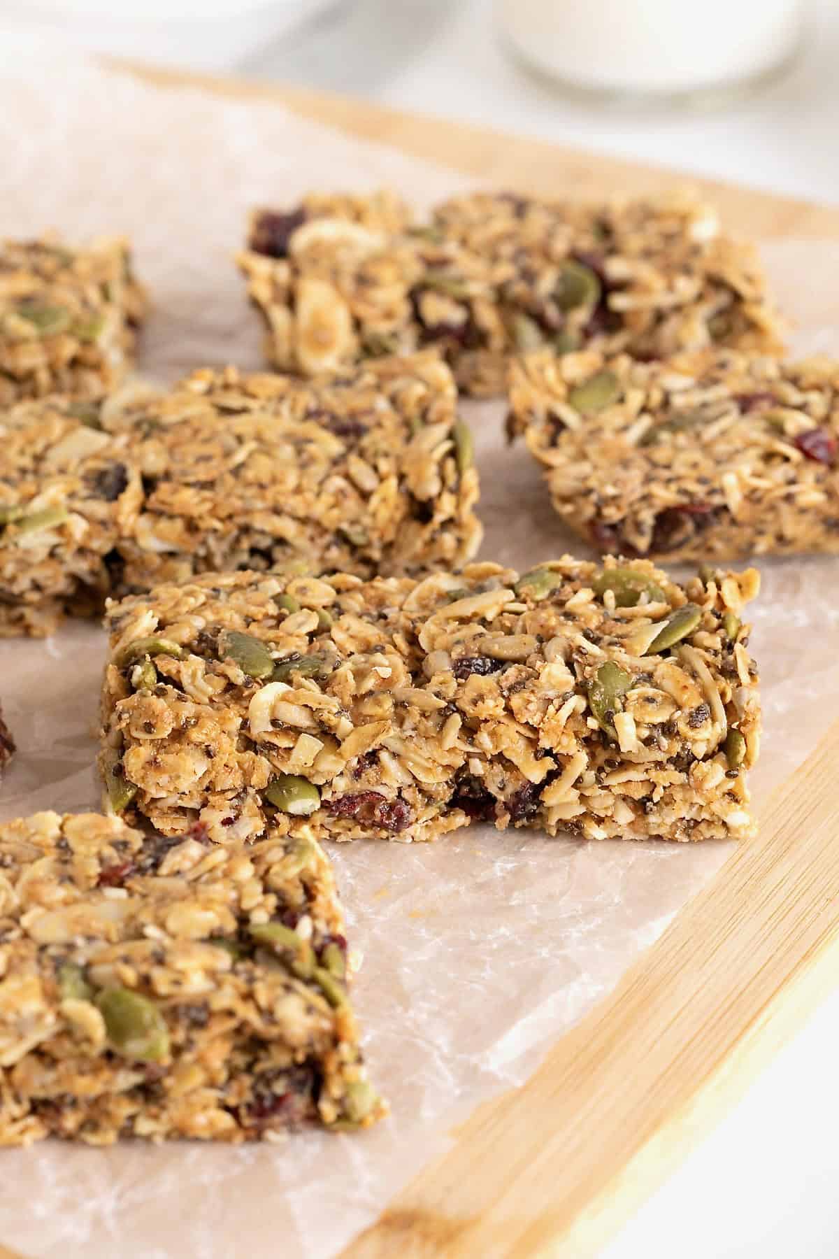 Six power bars on a parchment lined wooden board.