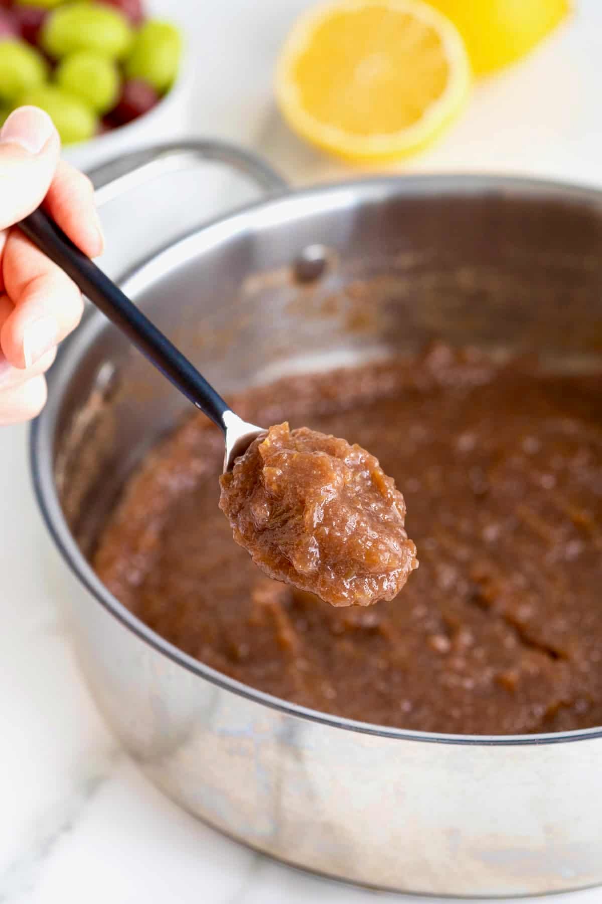 A shallow sauce pan of homemade grape jam.
