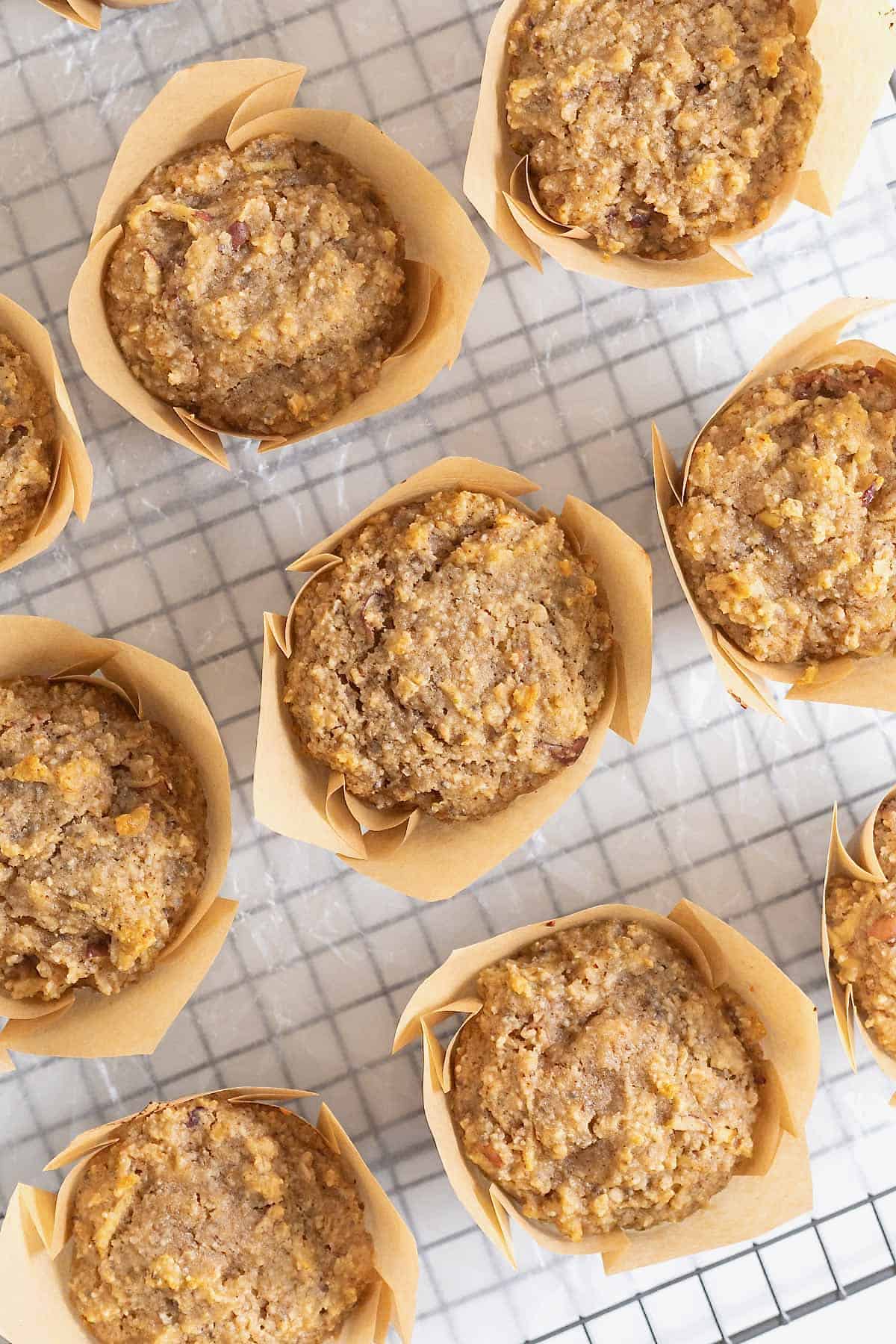 Nine superfood muffins on a wire cooling rack.