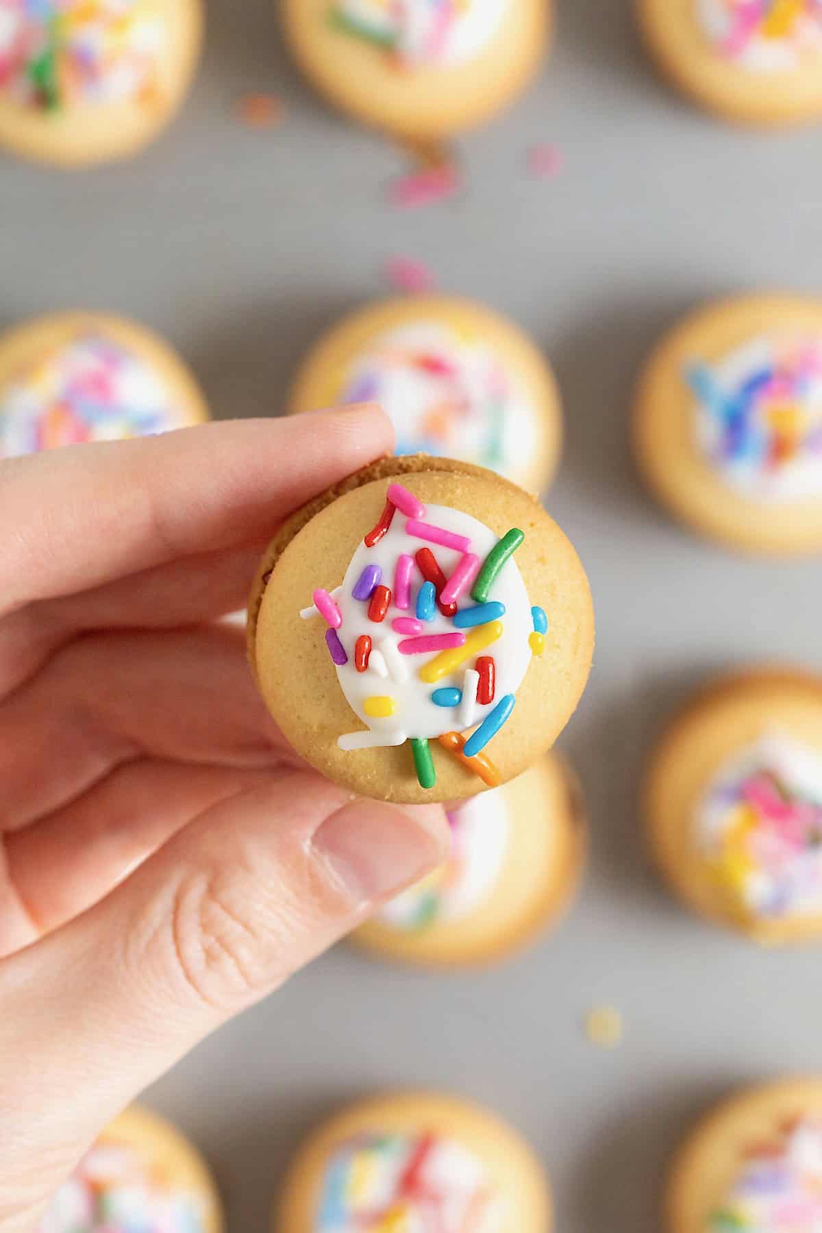 A hand holding a Nilla Wafer Pop Tart bite.