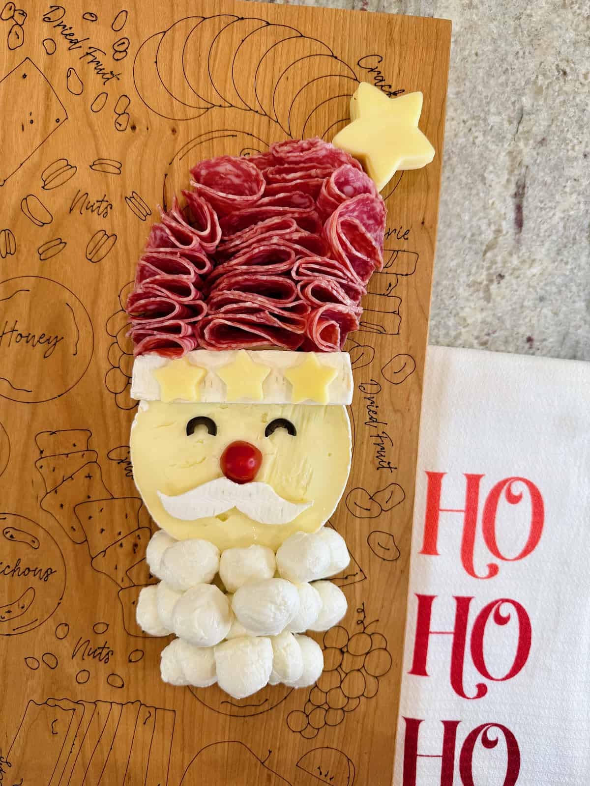 Charcuterie Santa on The BakerMama signature board.