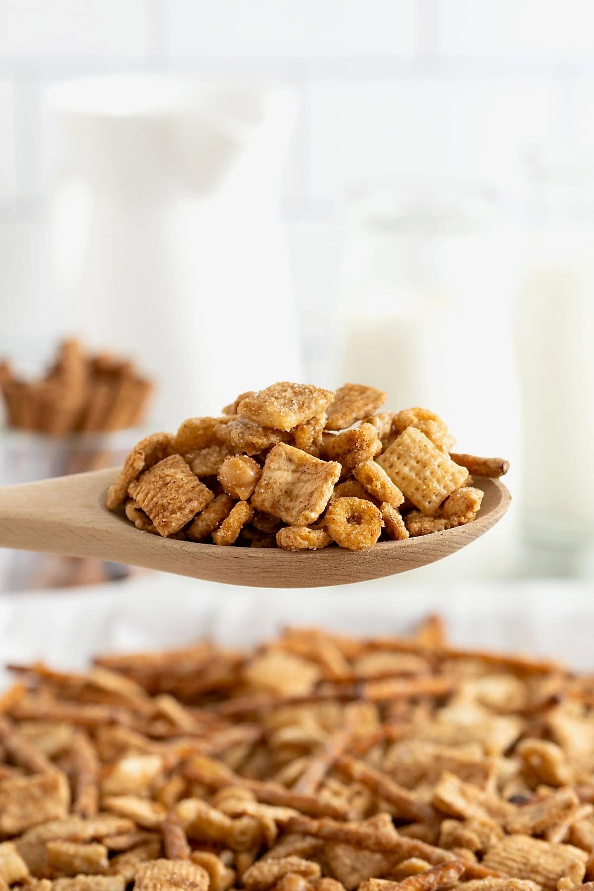 A wooden spoonful of churro snack mix.